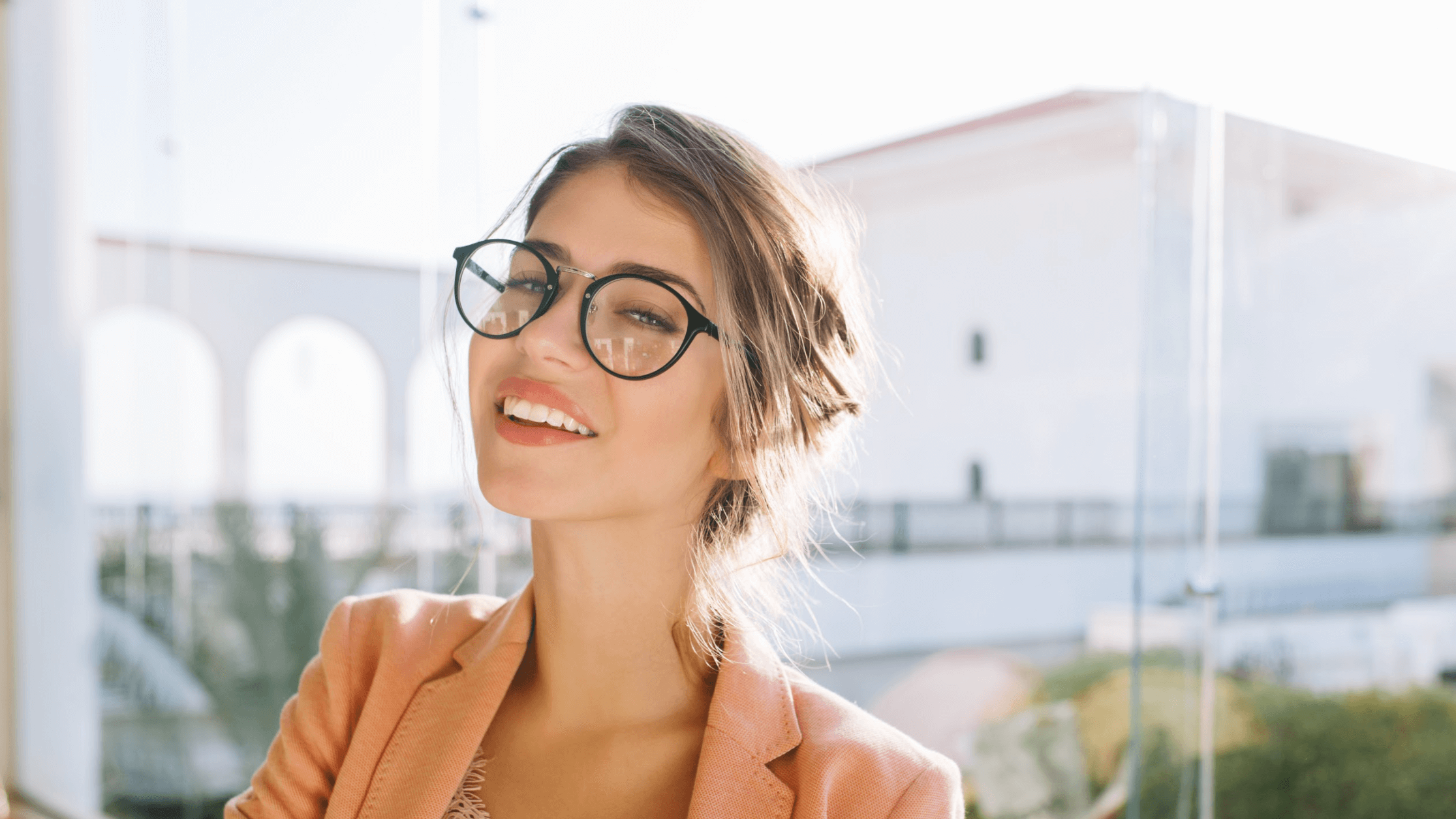 woman in glasses smiling